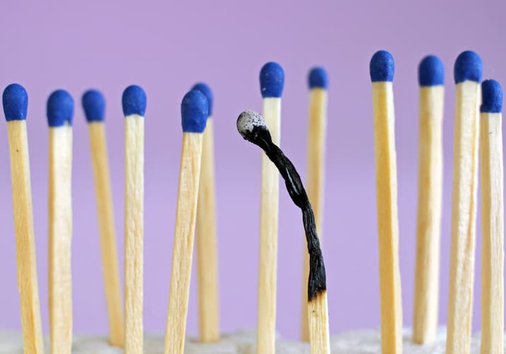 Row of matches, one is burnt.